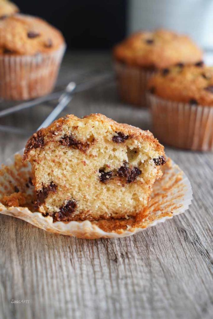 Chocolate Chip muffin cut in half showing the cake crumb.