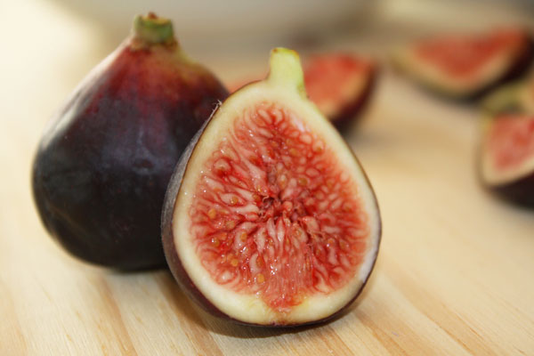 Fresh fig sliced open.