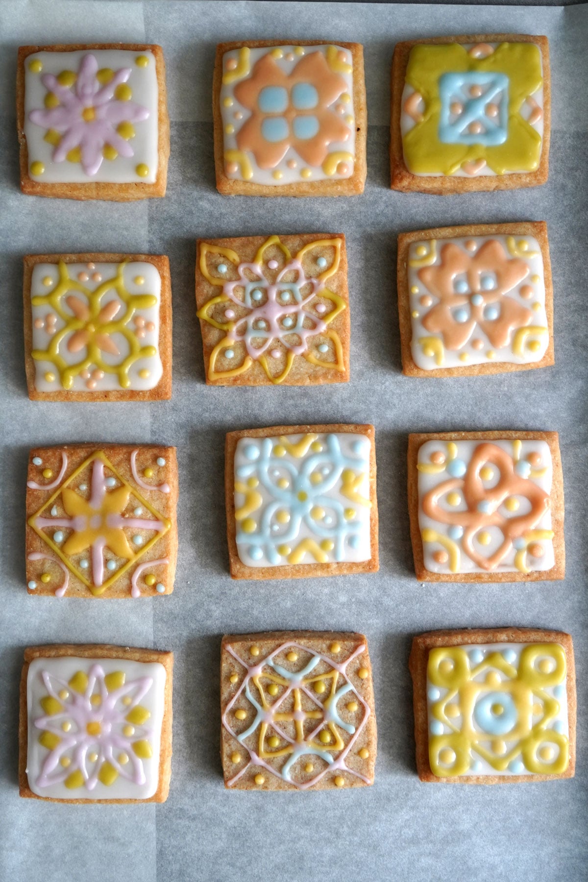 An overhead shot of rangoli cookies drying to show various designs. 