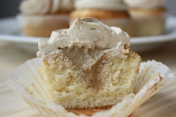 Vanilla bean cupcake cut open to show espresso cream filling.