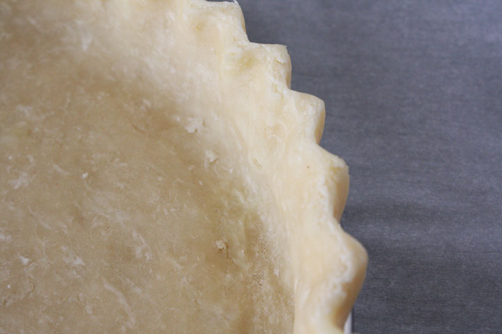 Pie crust rolled out and shaped edges.