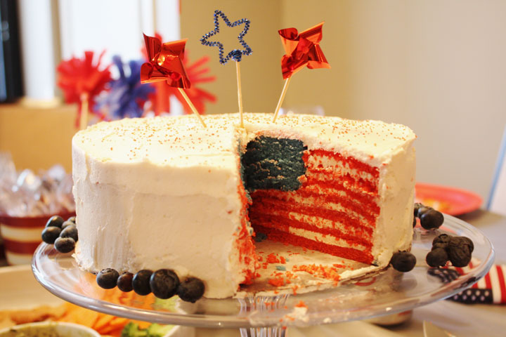 Cake sliced open to reveal American flag pattern inside.