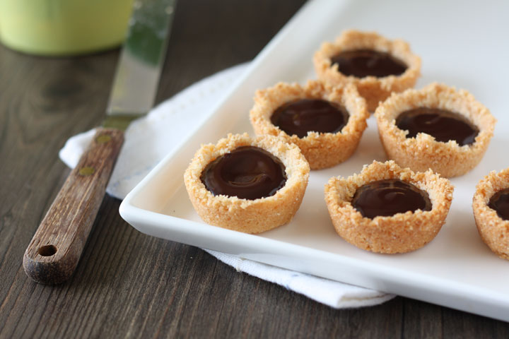 Mini chocolate ganache pie in white tray