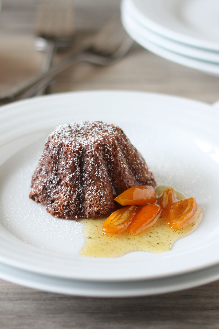 Chocolate lava cake plated with kumquat sauce