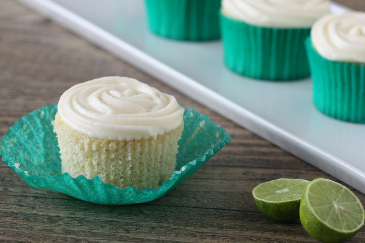 Key lime cupcake with wrapper opened.