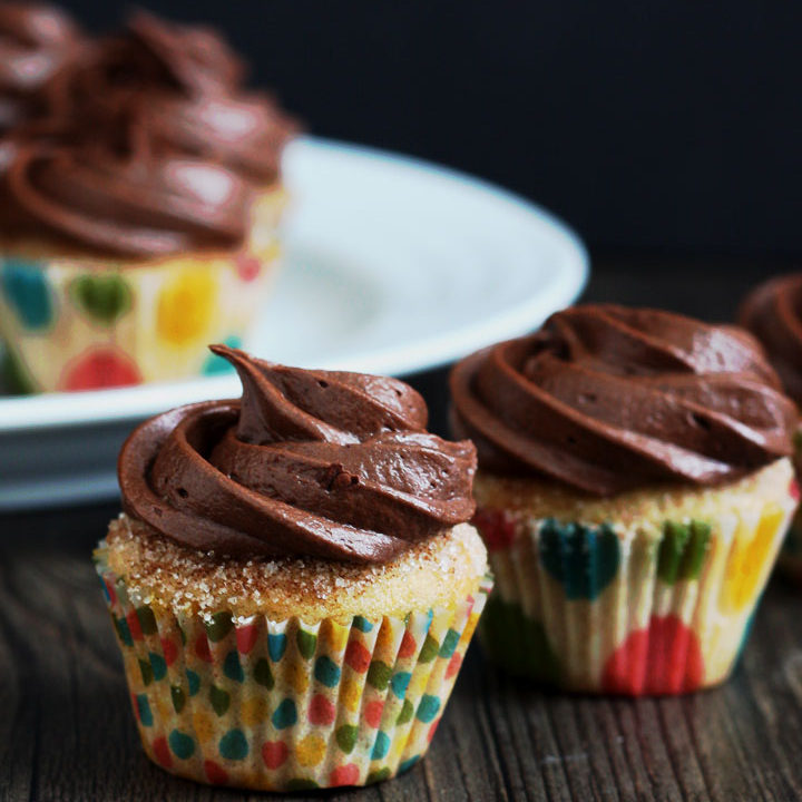 Churro Cupcakes are full of cinnamon flavor and topped with a delicious chocolate cream cheese frosting.