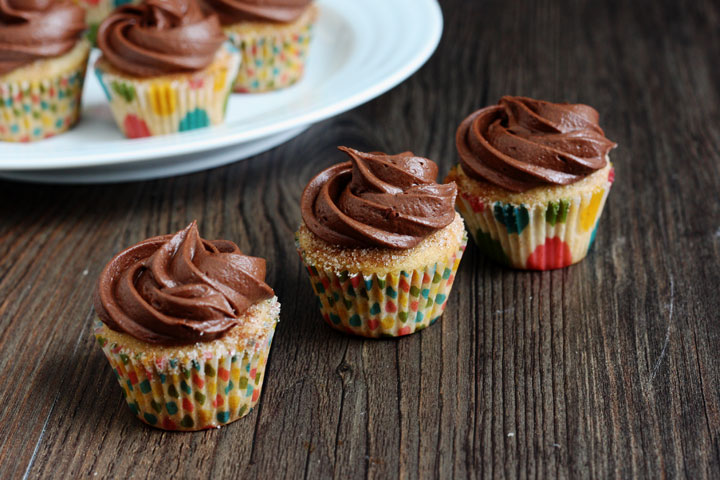 Churro Cupcakes are full of cinnamon flavor and topped with a delicious chocolate cream cheese frosting.