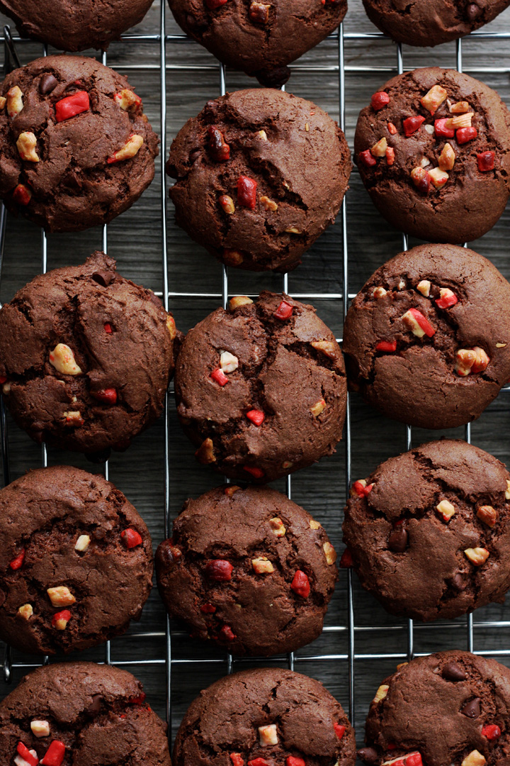 Top view of chocolate peppermint cake mix cookies cooling on metal rack.