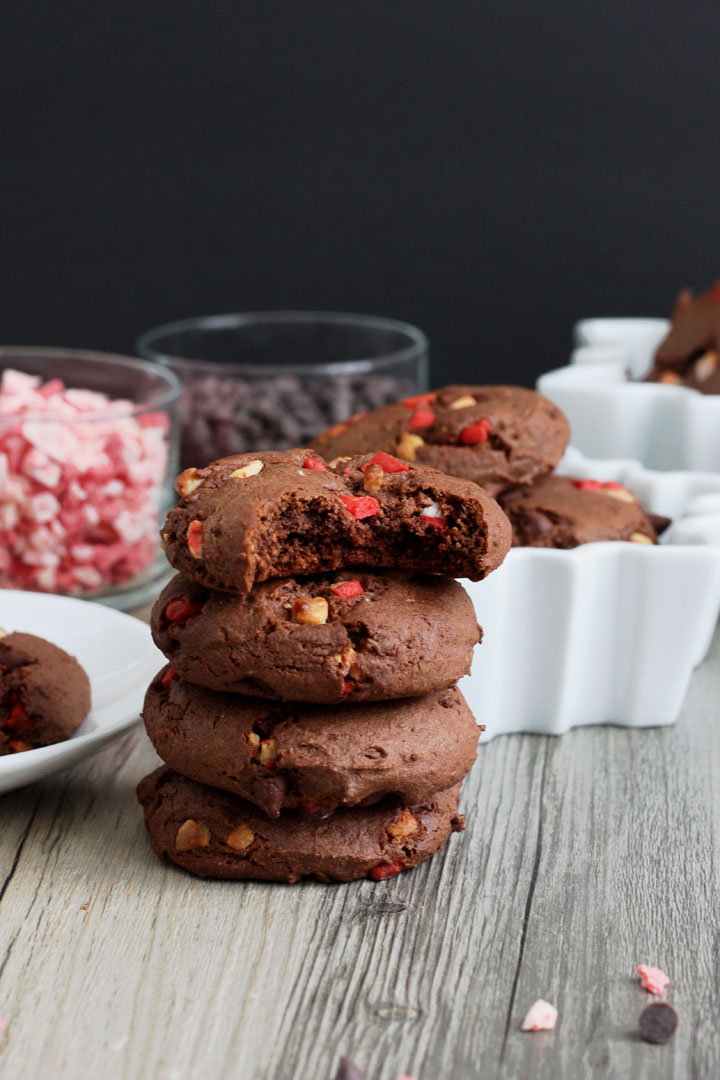 Stack of chocolate peppermint cake mix cookies with top cookie bitten.