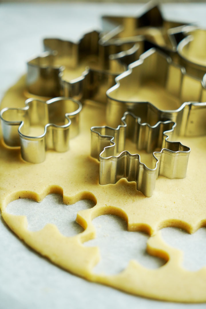 Cookie cutters on sugar cookie dough.