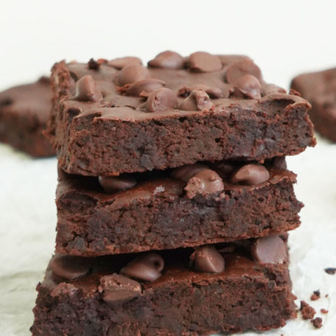 Three black bean brownies stacked on top of each other.