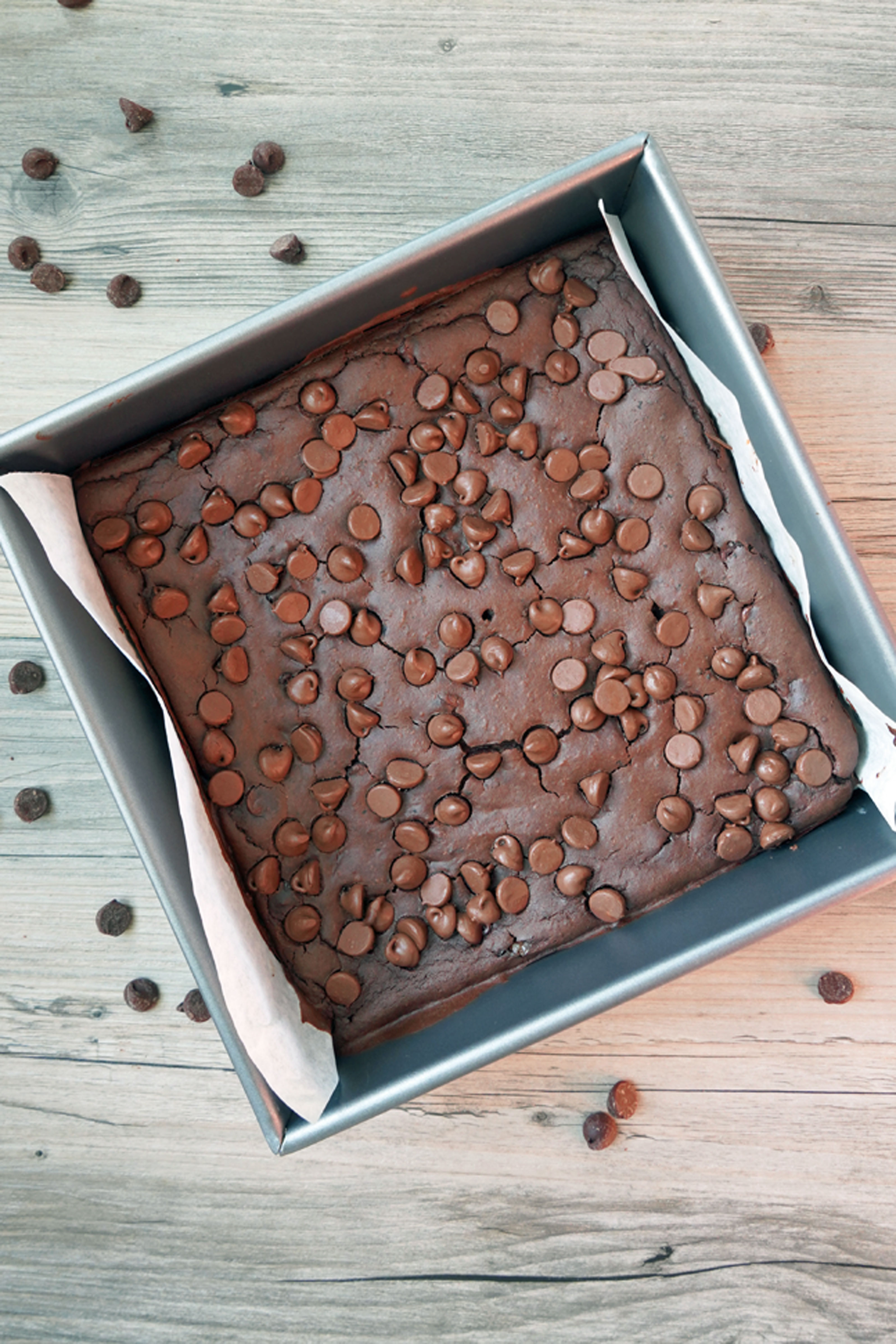 Black bean brownies, uncut and baked in a square pan. Top view.