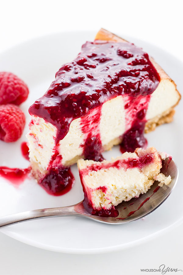 A slice of healthy cheesecake with berry topping.