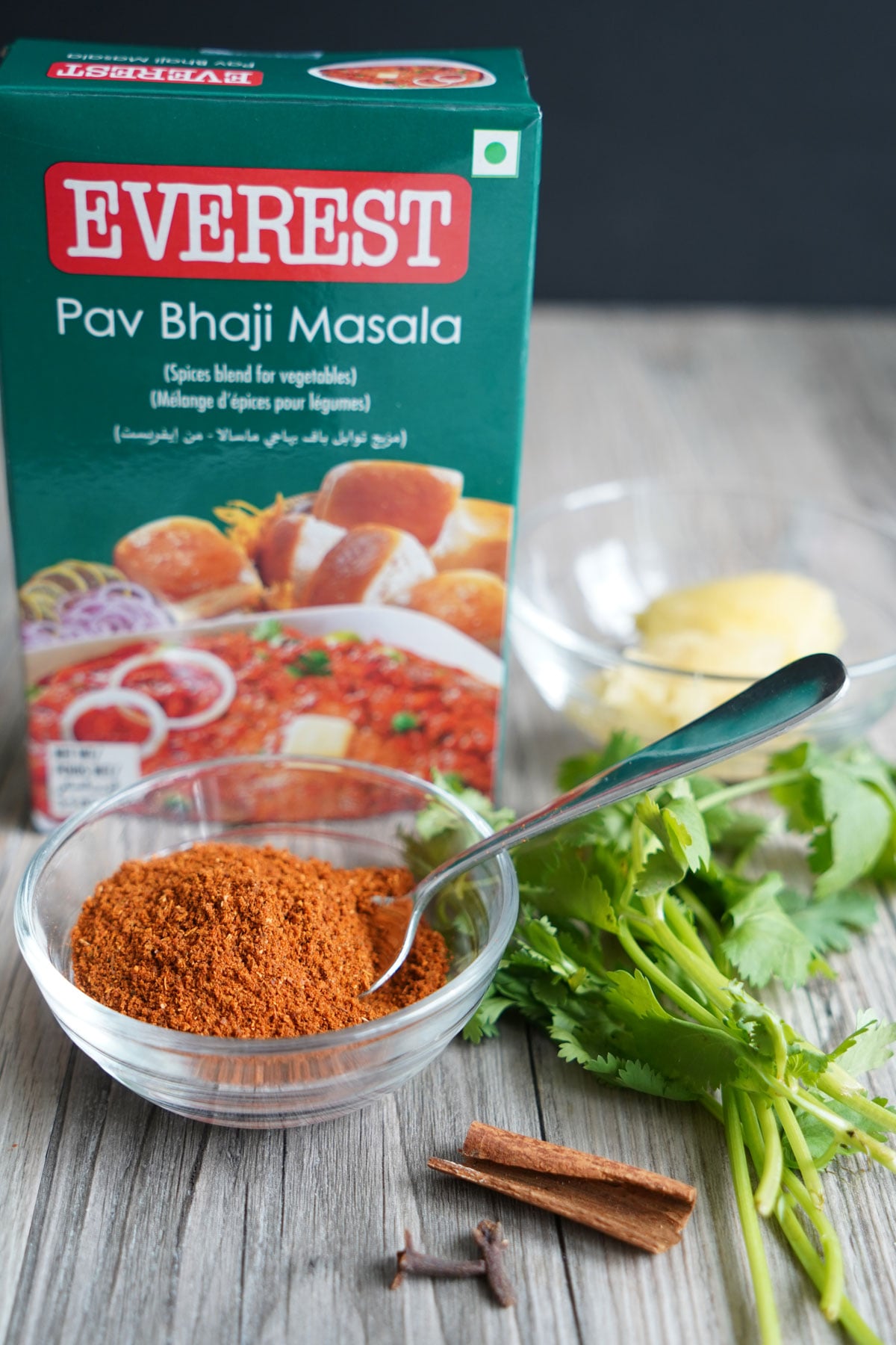 Everest brand pav bhaji masala box and masala in a small bowl. 