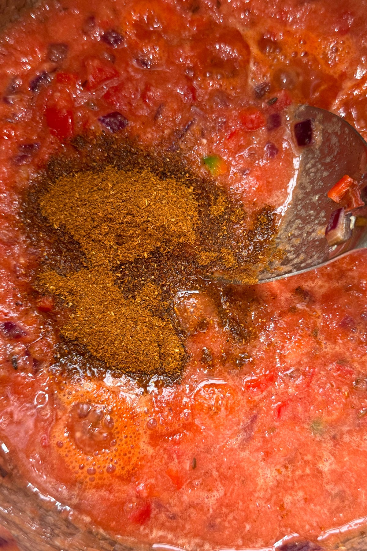 Tomato puree and pav bhaji masala added to the Instant Pot.