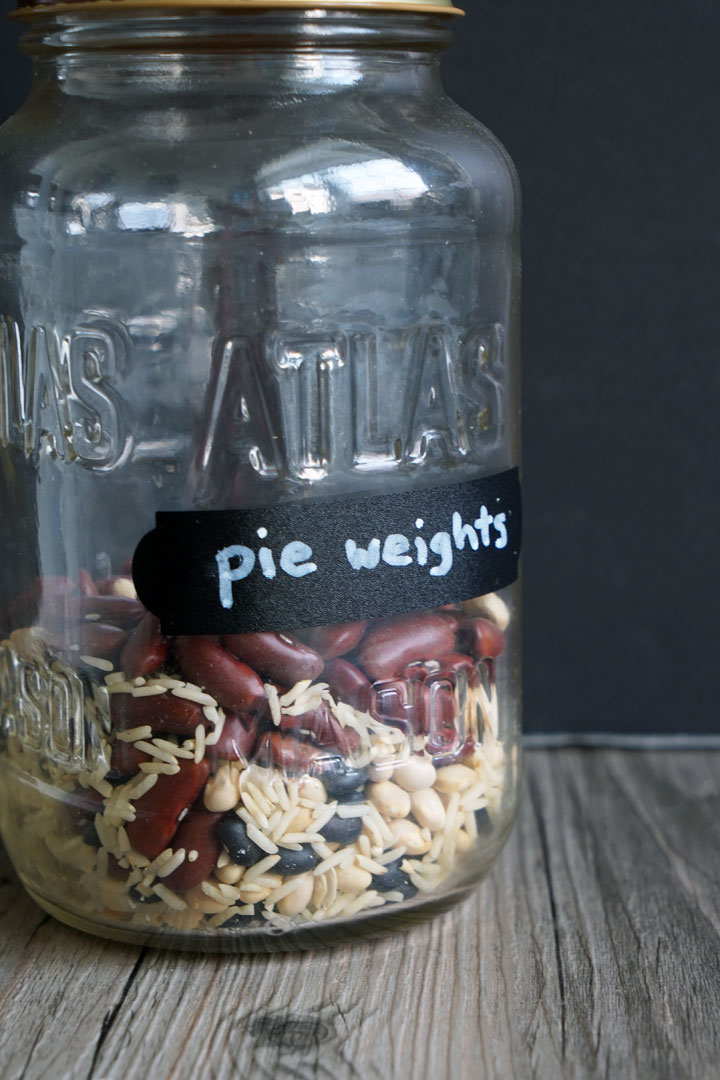 Jar of pie weights made of mixed beans and rice.