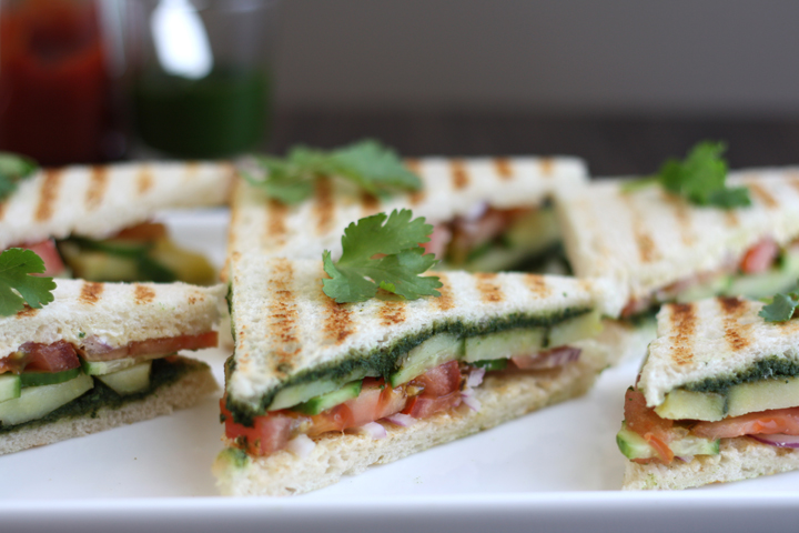 Bombay sandwich halves on a white platter.