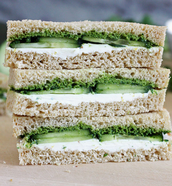 Stack of three cucumber and mint cilantro chutney teas sandwiches.