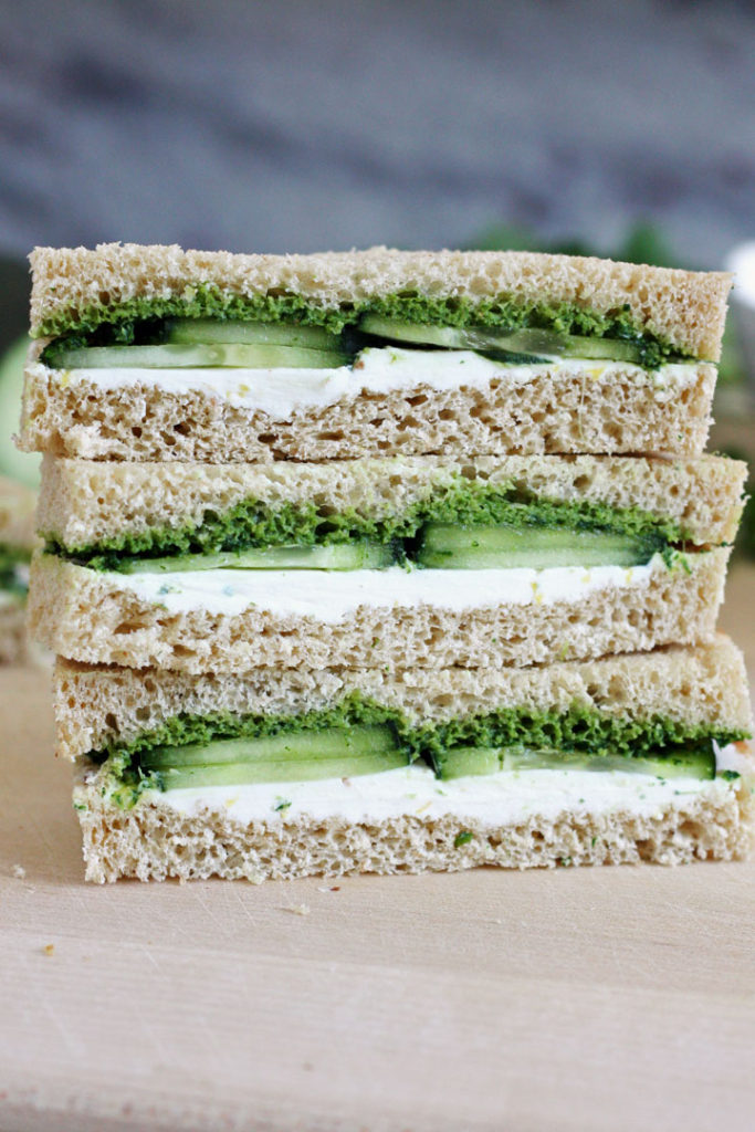 Stack of three cucumber and mint cilantro chutney teas sandwiches.