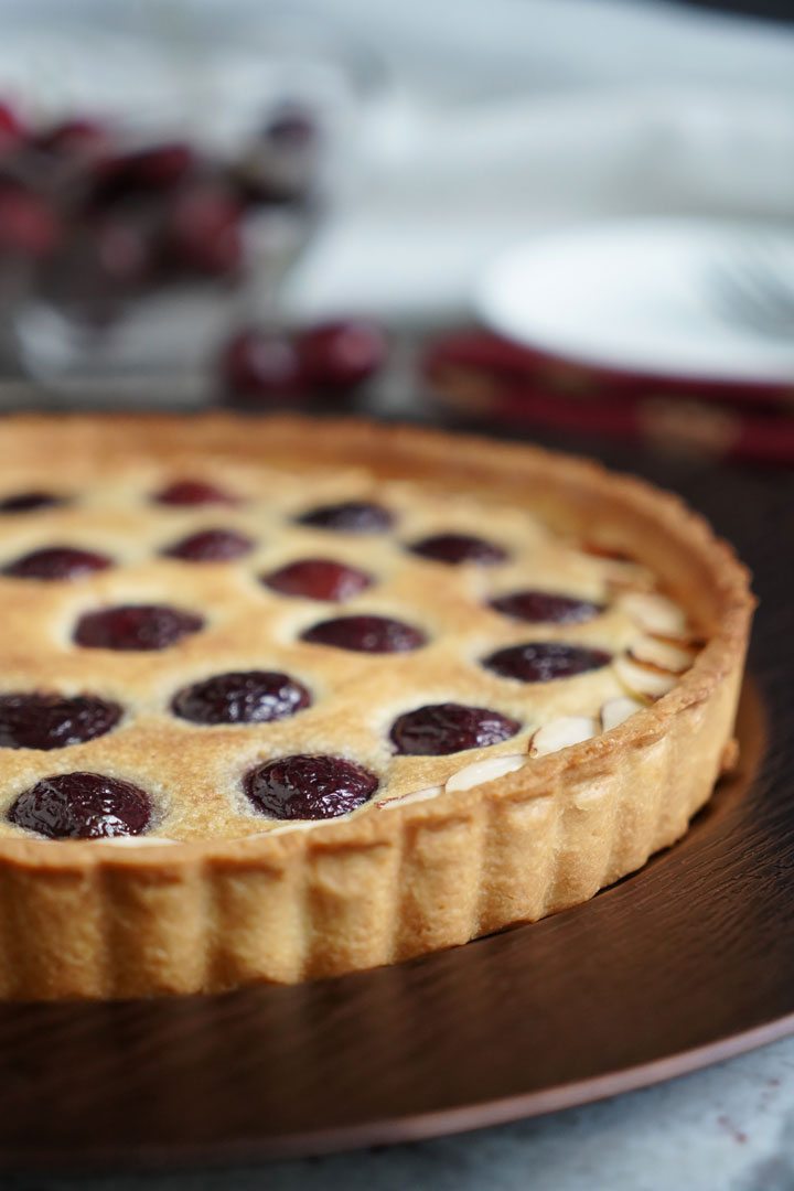 Close up view of whole cherry tart.