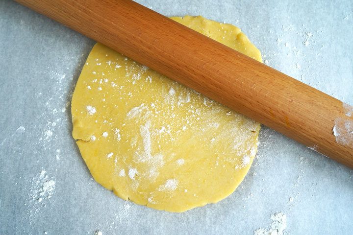 Top view of sweet tart dough being rolled out.