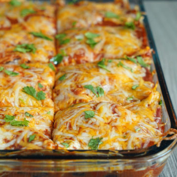 Close up view of vegetarian enchilada casserole tray.