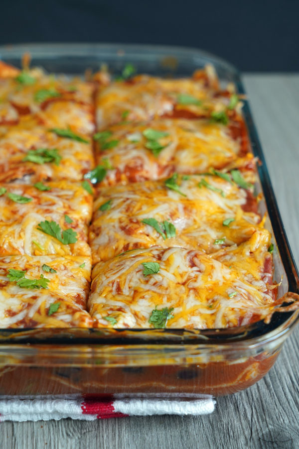 Close up view of vegetarian enchilada casserole tray.