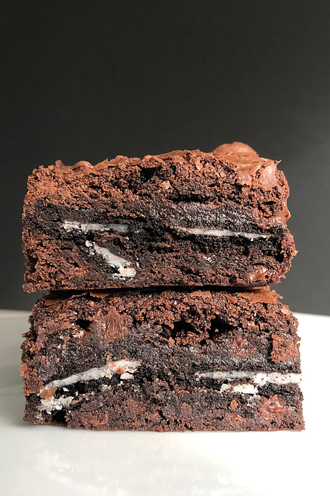 Close up detail of two Oreo stuffed brownies stacked. 