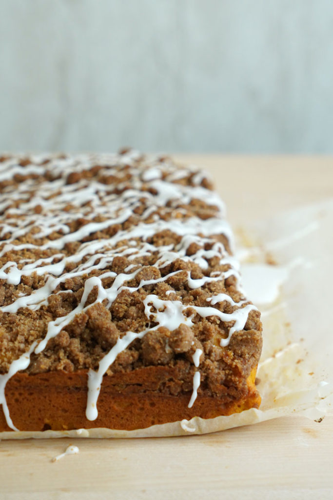 Pumpkin coffee cake with vanilla glaze.