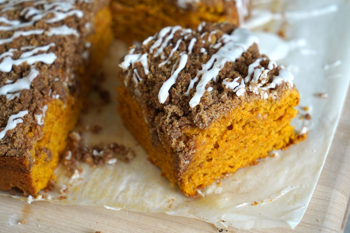 Cut piece of pumpkin coffee cake with cinnamon streusel.