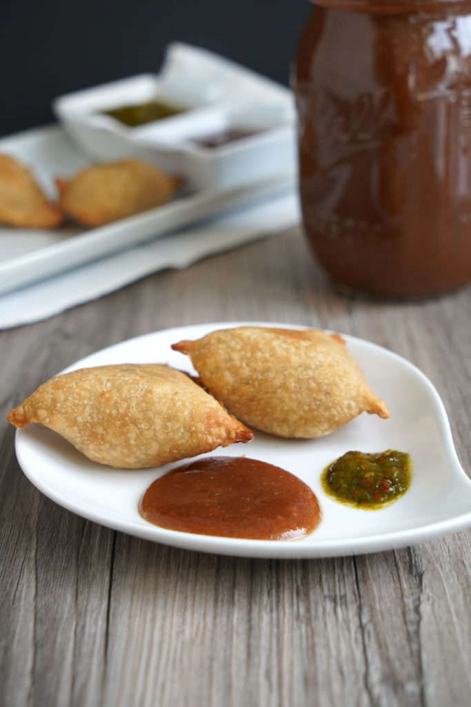 Tamarind date chutney served with samosa.