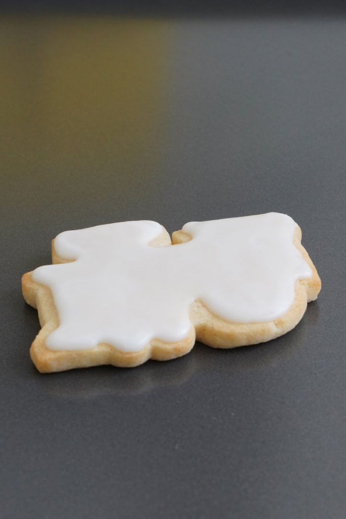 Train shaped sugar cookie in white icing.