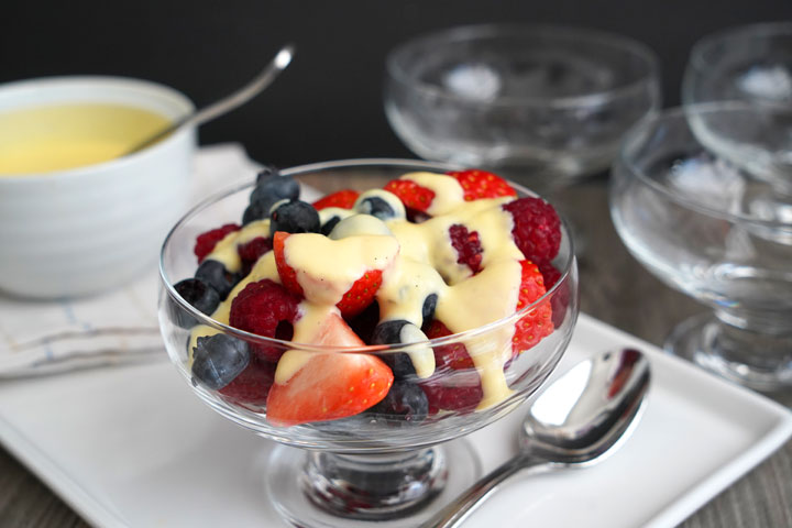 Fresh berries served with vanilla custard sauce poured over.