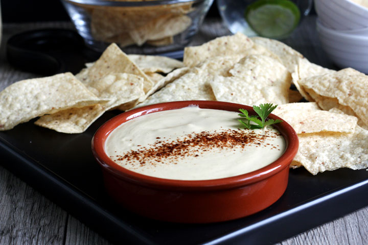 Vegan queso dip with tortilla chips.