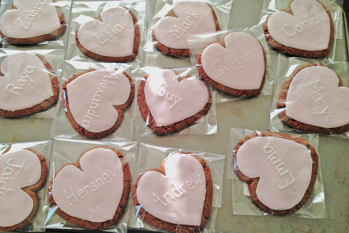 Heart shaped sugar cookies personalized with names.