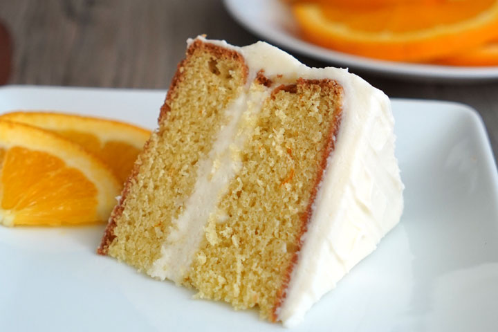 Horizontal image of cake on a white plate showing top frosting.