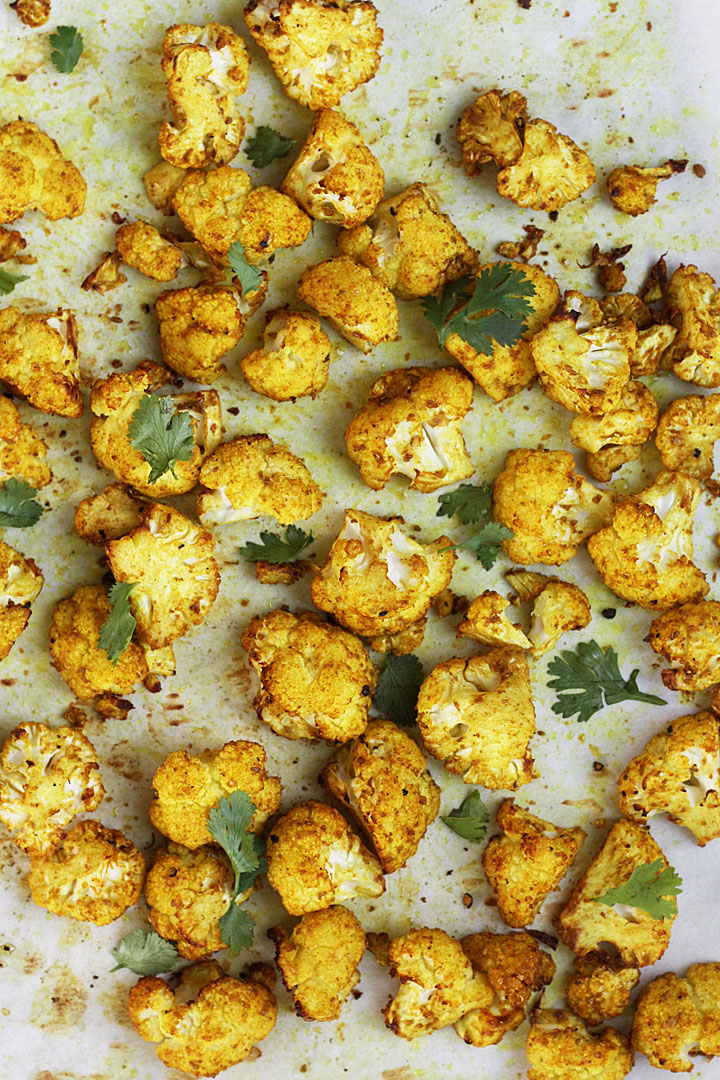 Roasted cauliflower on a sheet pan.