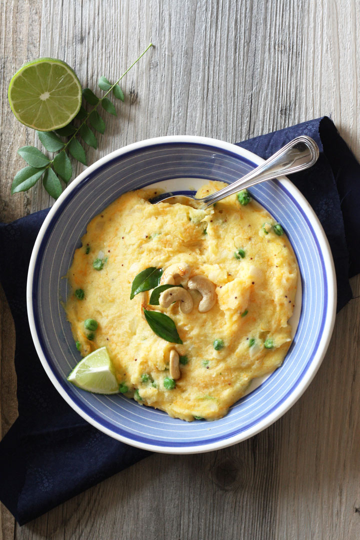 Dish of upma served with lime juice.