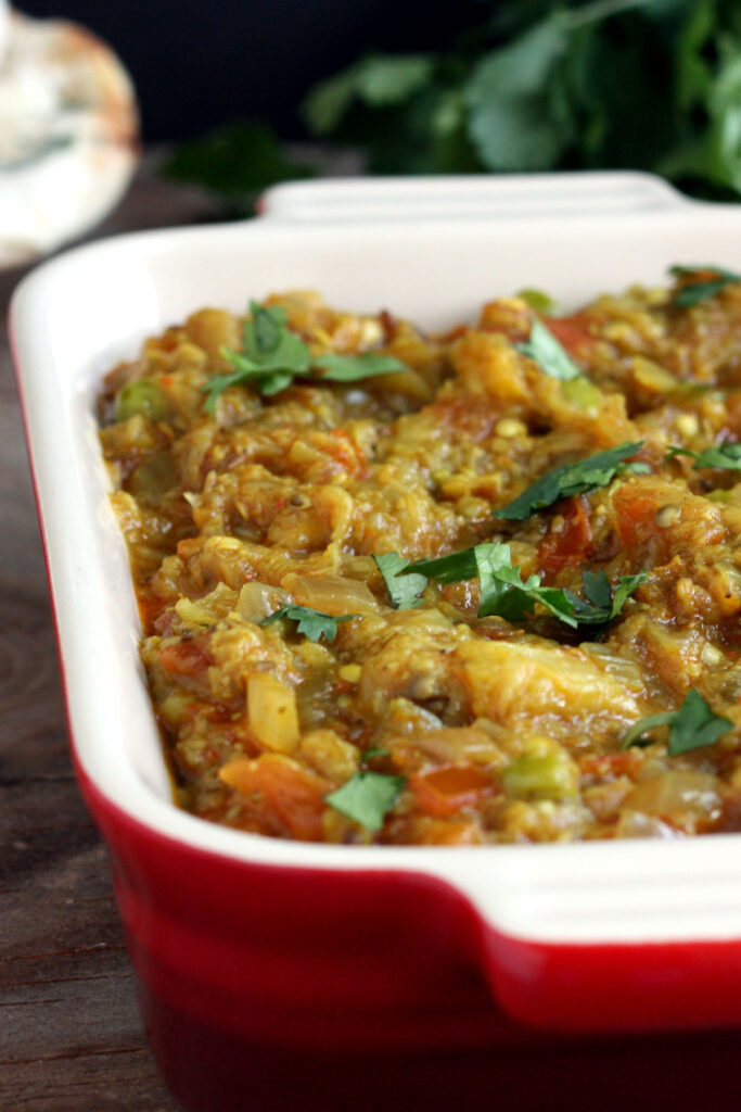 Close up view of baingan bharta in serving dish.