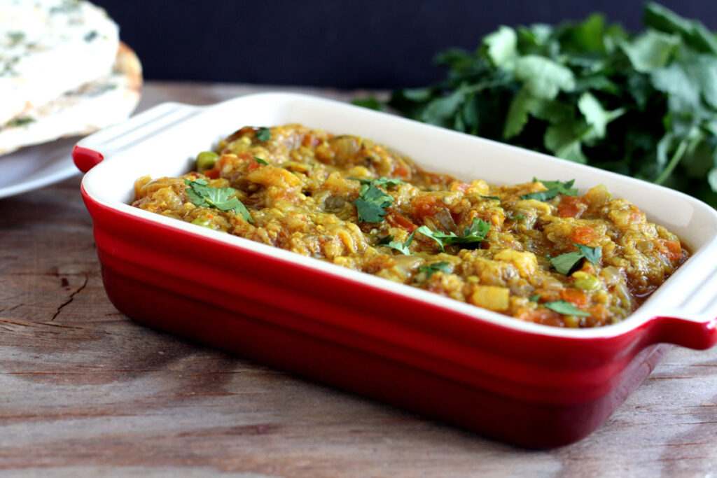 Baingan Bharta in small red server.