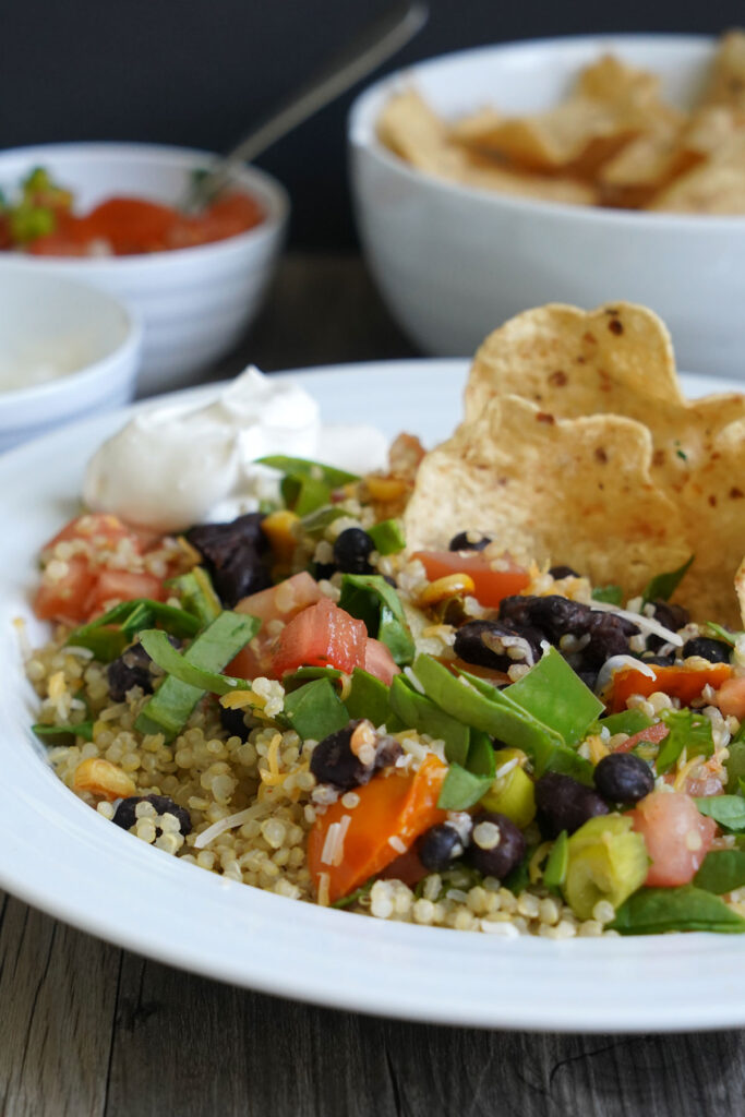 Close up view of mixed quinoa burrito bowl.