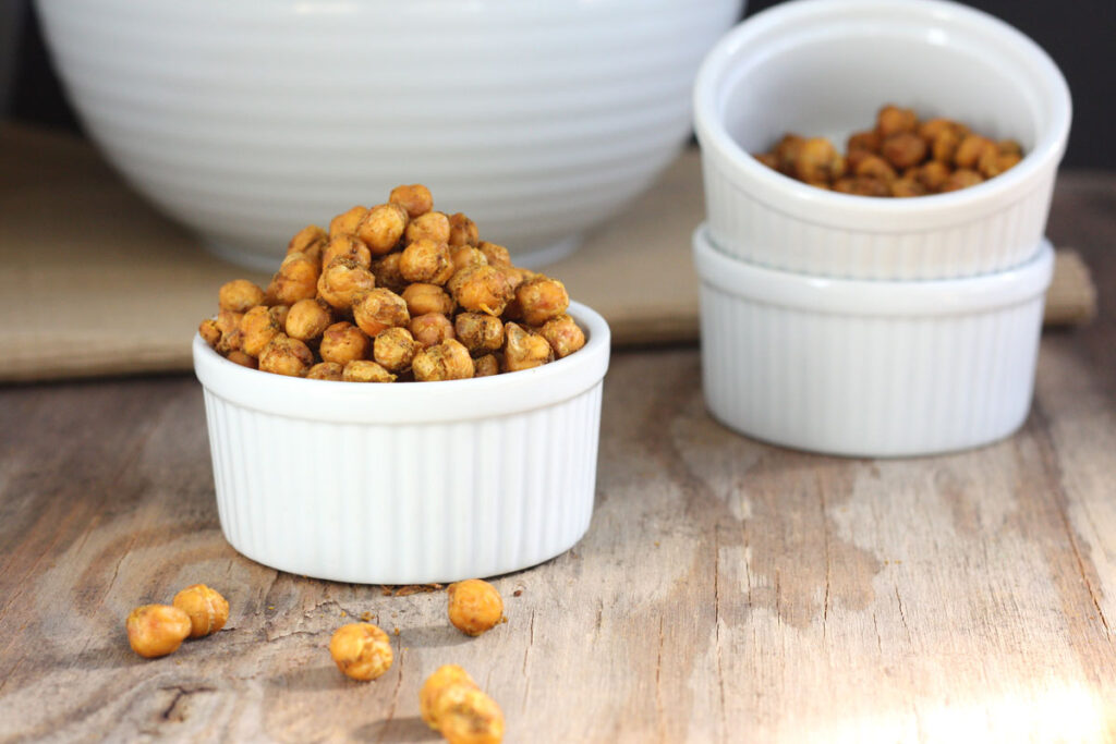 Spicy roasted chickpeas in white bowls.