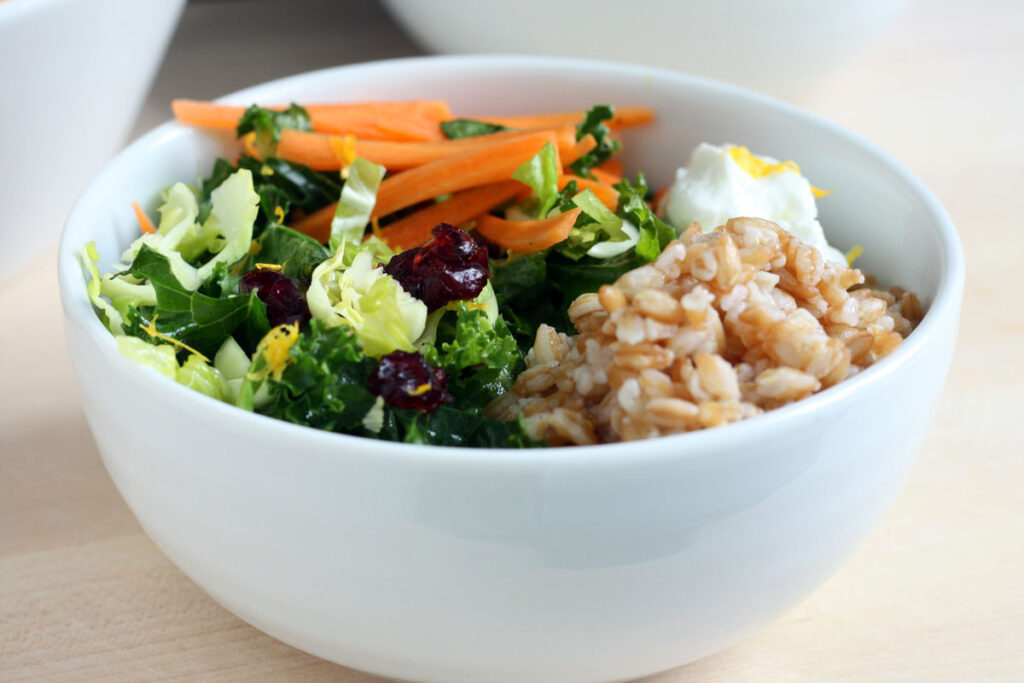 Buddha bowl ingredients in a white bowl.