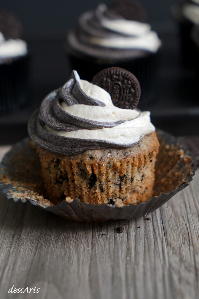 Oreo cupcake with liner peeled off.