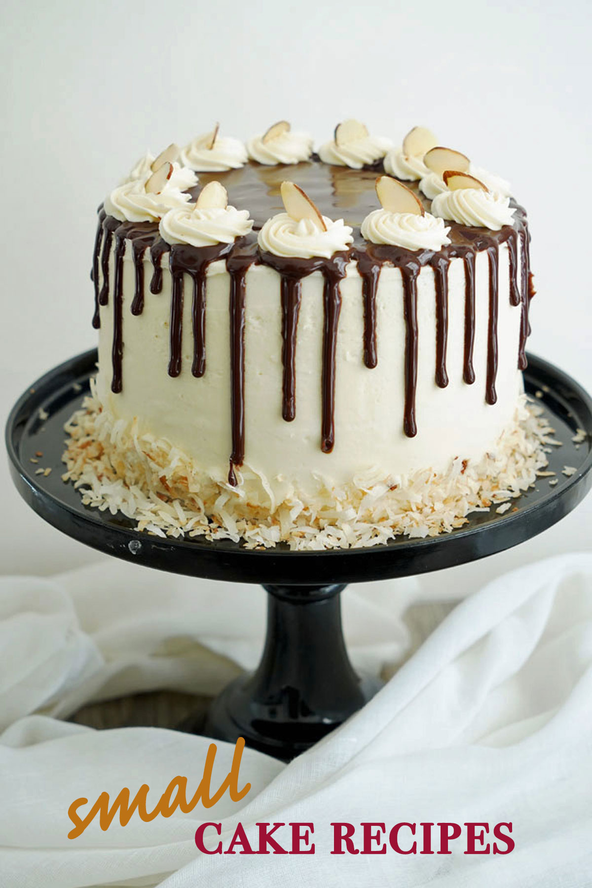 Small almond coconut cake on a black cake stand with "small cake recipes" text. 