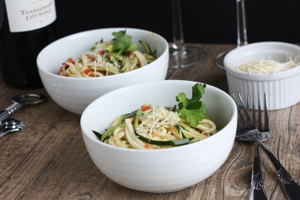 Two bowls of zucchini salad.