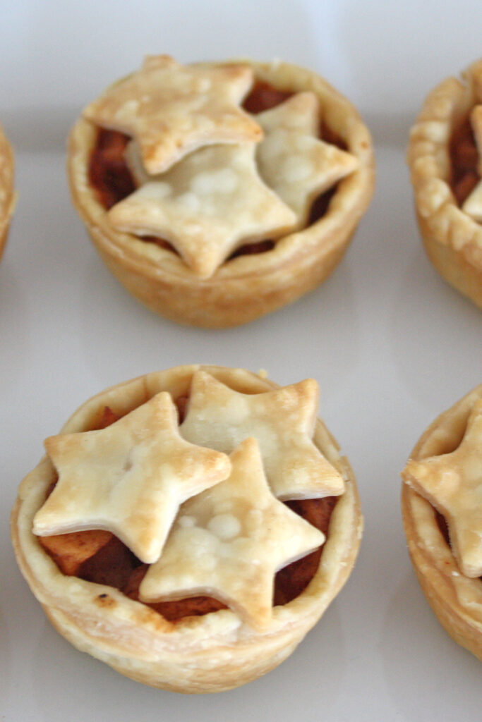 Mini apple pie with star cut outs.