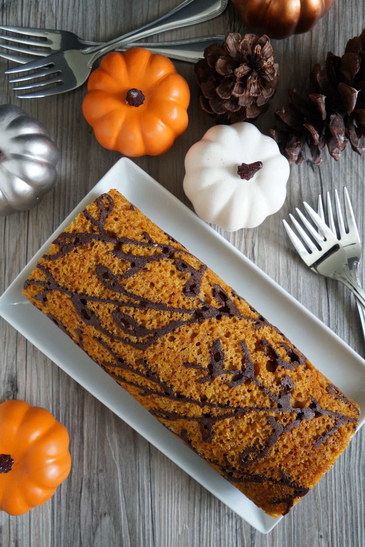 Top view of patterned pumpkin roll showing baked inlay design.