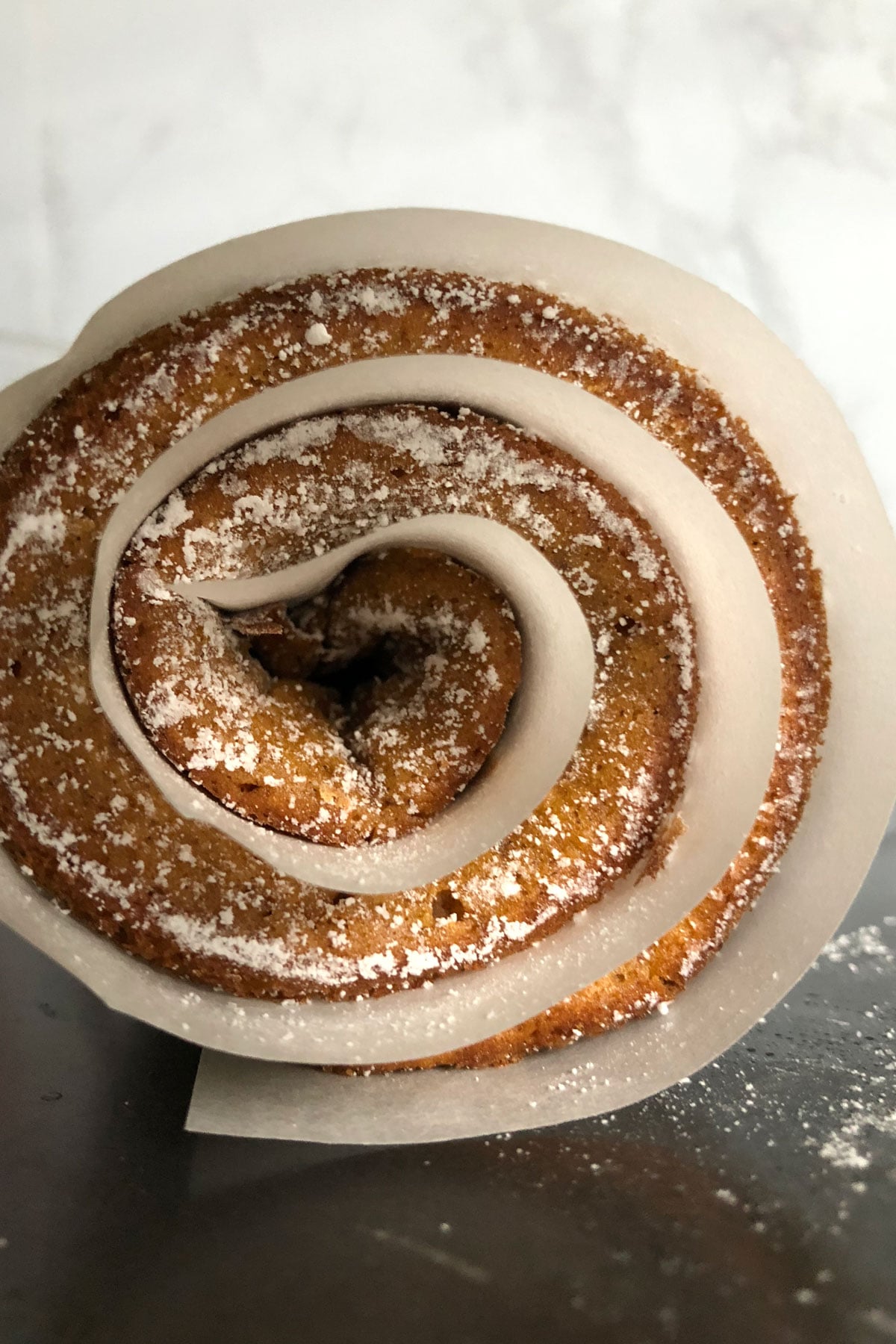 Rolled up pumpkin cake cooling.