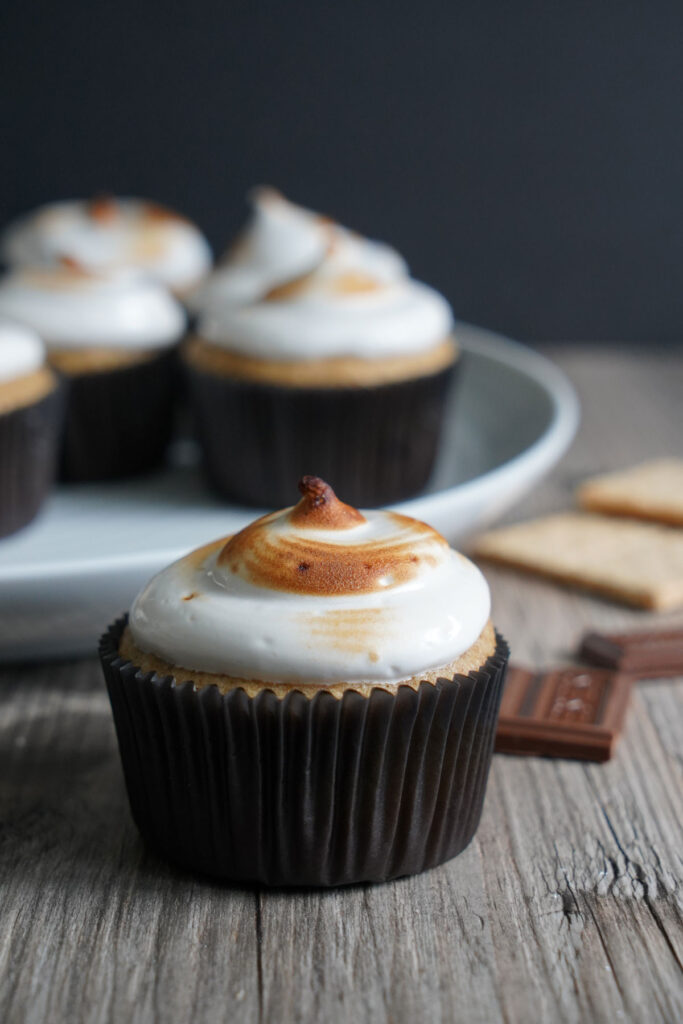 S'more cupcake with more cupcakes in background.